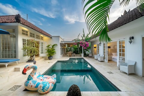 Property building, Patio, Pool view, Swimming pool, sunbed