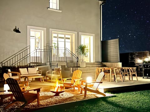 Property building, Patio, Night, View (from property/room), Balcony/Terrace, Living room, Seating area