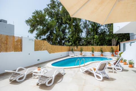 Property building, Living room, Swimming pool