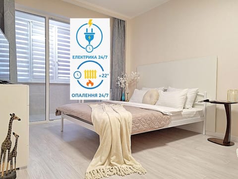 Bed, Property logo or sign, Photo of the whole room, Logo/Certificate/Sign, Bedroom, Text overlay, Certificate/Award, towels