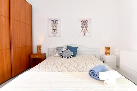 Bed, towels, wardrobe