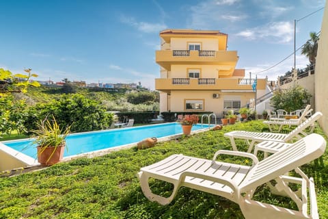 Property building, Living room, Swimming pool