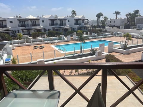 Property building, Patio, Day, View (from property/room), Balcony/Terrace, Pool view, Swimming pool, Swimming pool, sunbed