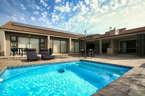 Property building, Patio, Day, Pool view, Swimming pool