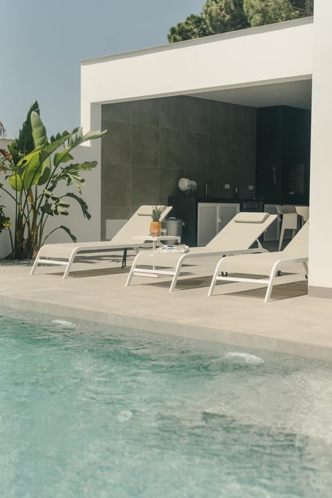 Swimming pool, sunbed