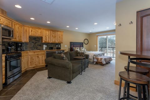 Bed, dishwasher, stove, kitchen