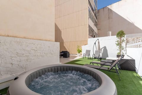 Patio, Day, Hot Tub, Hot Tub, Balcony/Terrace, sunbed