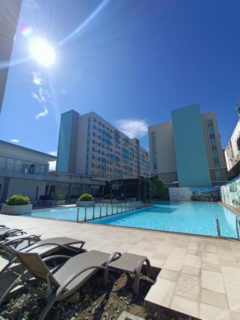 Property building, Day, Pool view, Swimming pool, sunbed