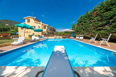 Property building, Natural landscape, Pool view, Swimming pool, sunbed