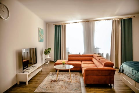 Bed, TV and multimedia, Living room, Seating area, Evening entertainment