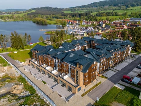Property building, Nearby landmark, Day, Neighbourhood, Natural landscape, Bird's eye view, Lake view, Parking