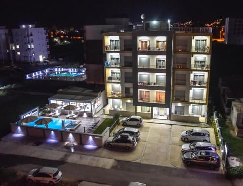 Property building, Patio, Night, Neighbourhood, Evening entertainment, Pool view, Street view, Swimming pool, Parking