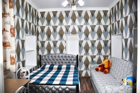 Bed, Living room, Seating area, Bedroom