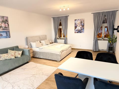 Bed, Living room, Seating area, Bedroom