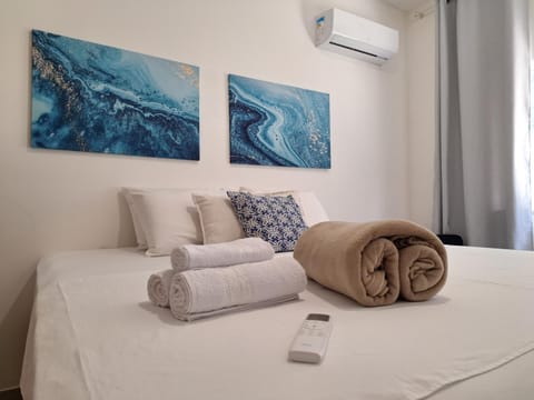 Bed, Photo of the whole room, Bedroom, towels, air conditioner