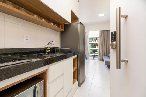 Kitchen or kitchenette, microwave, stove