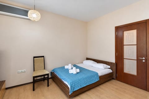 Bed, towels, wardrobe, air conditioner