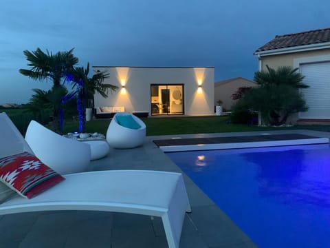 Property building, Patio, Night, Pool view, Swimming pool, sunbed