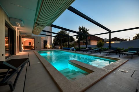 Patio, Day, Natural landscape, Pool view, Swimming pool, sunbed