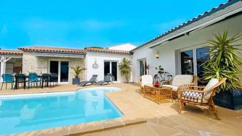 Property building, Patio, Pool view, Swimming pool, sunbed