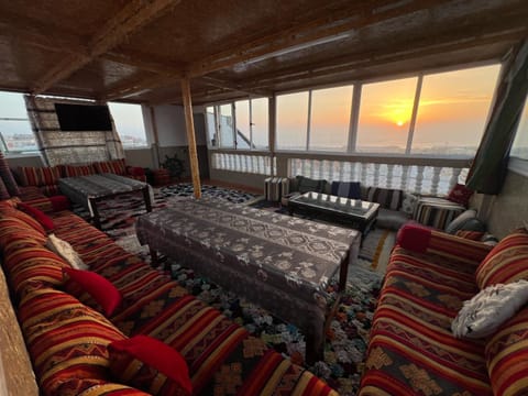 Communal lounge/ TV room, Natural landscape, View (from property/room), Balcony/Terrace, Living room, Photo of the whole room, Seating area, Evening entertainment, Meeting/conference room, Sea view, Sunset, Internal: Not applicable to any particular room
