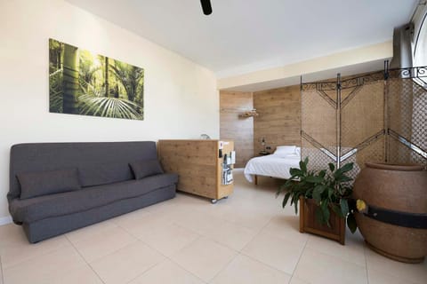 Bed, Living room, Seating area, Bedroom