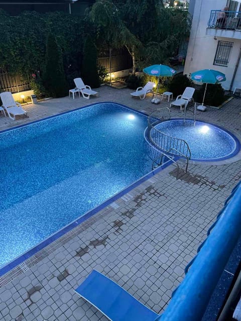 Patio, Night, Pool view, Swimming pool, sunbed