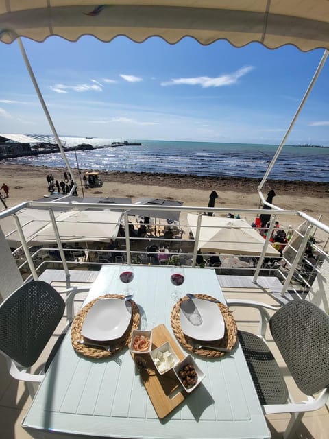 Natural landscape, View (from property/room), Balcony/Terrace, Seating area, Beach, Beach, Sea view