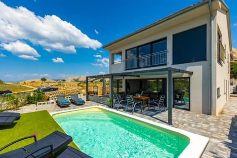 Property building, Seating area, Swimming pool, sunbed