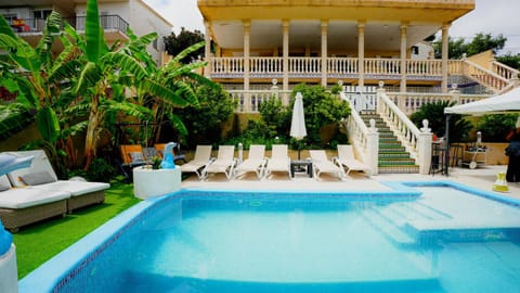 Property building, Patio, Day, Garden, View (from property/room), Balcony/Terrace, Garden view, Pool view, Swimming pool, sunbed