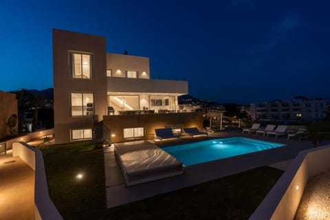 Property building, Patio, Night, Swimming pool, sunbed