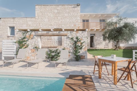 Property building, Patio, Pool view, Swimming pool, sunbed
