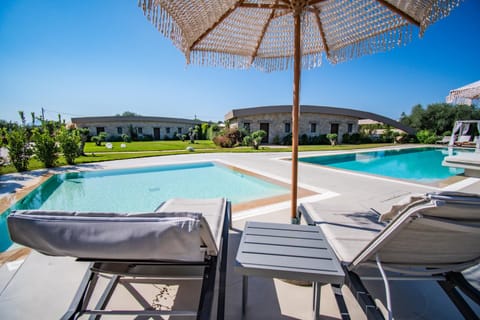 Property building, Day, Pool view, Swimming pool, sunbed