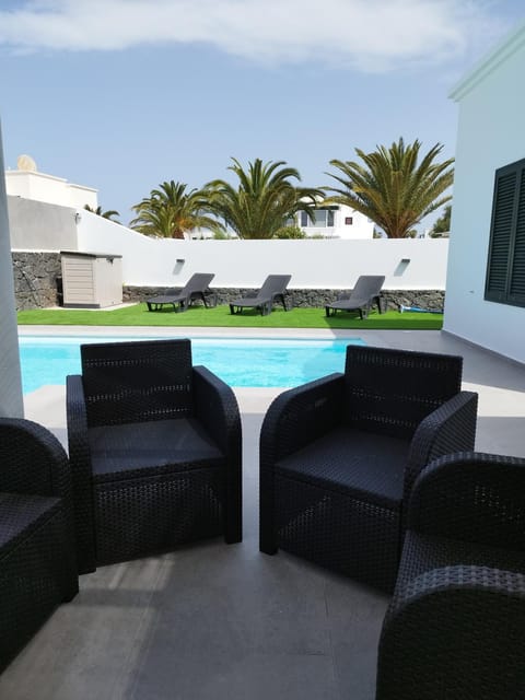 Patio, Seating area, Pool view, Swimming pool, sunbed