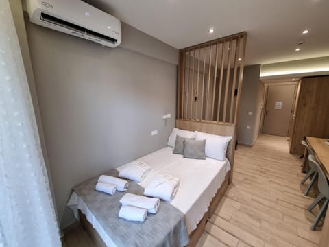 Bed, Photo of the whole room, Bedroom, towels, air conditioner