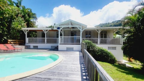 Property building, Patio, Day, Natural landscape, Garden, Pool view, Swimming pool, sunbed
