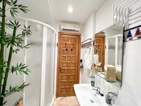 Shower, Bathroom, towels, wardrobe, air conditioner