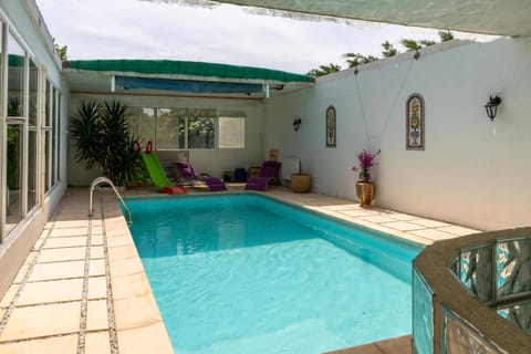 Property building, Living room, Swimming pool