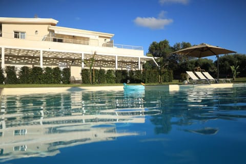 Property building, Day, Natural landscape, Pool view, Swimming pool