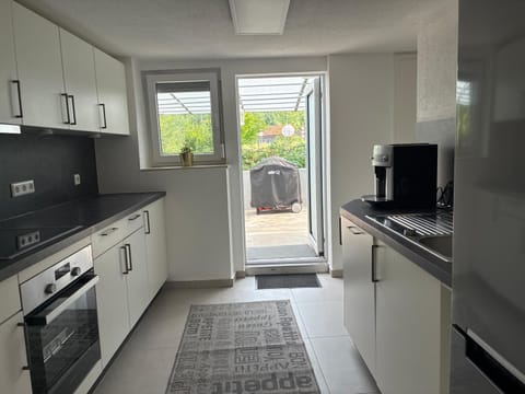 Kitchen or kitchenette, dishwasher, oven, stove, toaster
