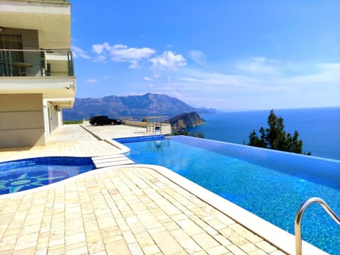 Property building, Patio, Nearby landmark, Natural landscape, View (from property/room), Mountain view, Pool view, Sea view, Swimming pool, Swimming pool, sunbed