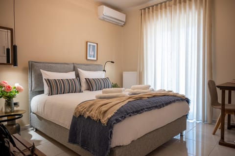 Bed, Photo of the whole room, Bedroom, towels, air conditioner
