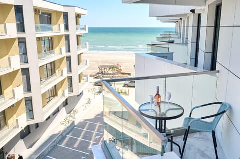 Property building, Patio, Day, Natural landscape, View (from property/room), Balcony/Terrace, Seating area, Beach, Sea view