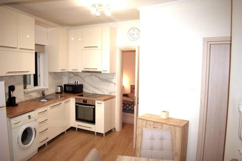 Kitchen or kitchenette, stove, washing machine