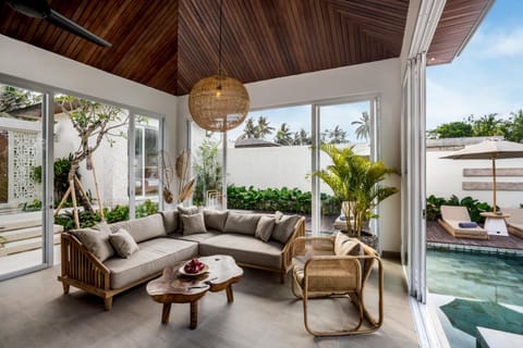Property building, Living room, Seating area, Pool view
