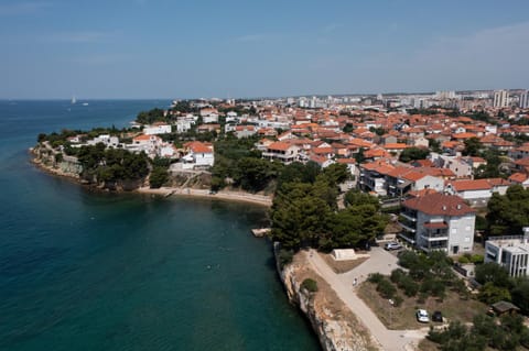 Property building, Neighbourhood, Natural landscape, Beach