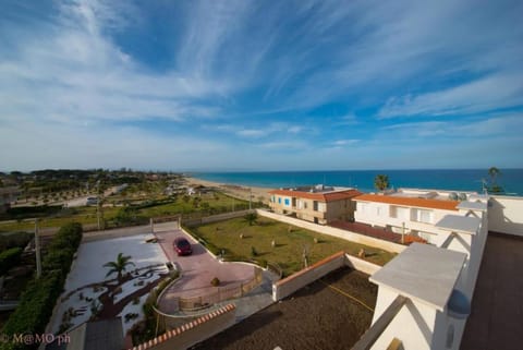 Property building, Nearby landmark, Day, Natural landscape, View (from property/room), Balcony/Terrace, Beach, Sea view