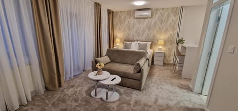 Bed, Living room, Seating area, Bedroom