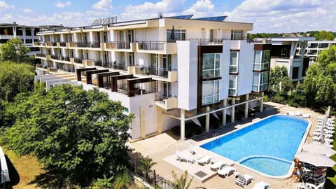 Property building, Patio, Facade/entrance, Day, View (from property/room), Balcony/Terrace, Pool view, Swimming pool, sunbed