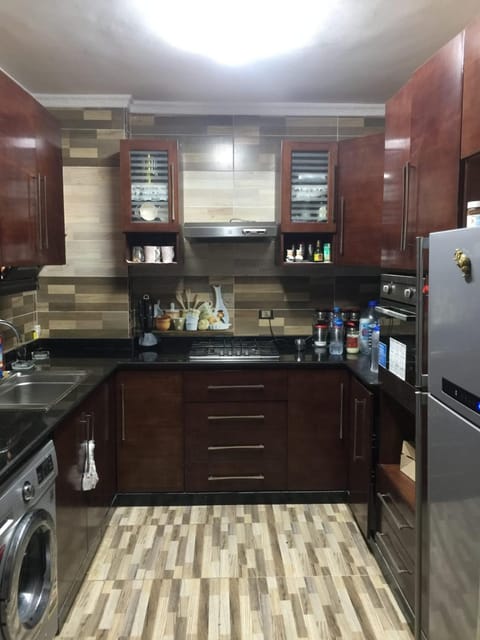 Kitchen or kitchenette, stove, washing machine